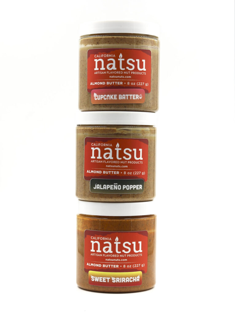 Three jars of different flavors of peanut butter.